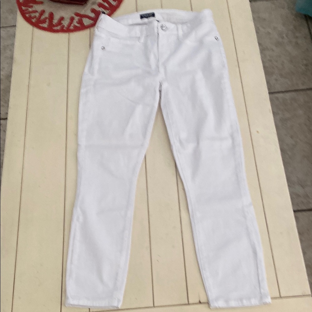 Women's White denim jeans by Bebe. Size 38” waist, 25 3/4”
Inseam. # 2656